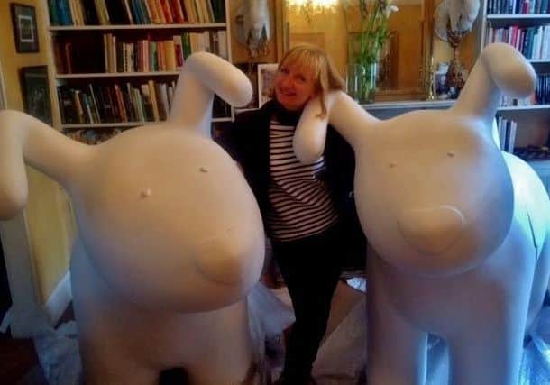 Judith with her two Snowdogs