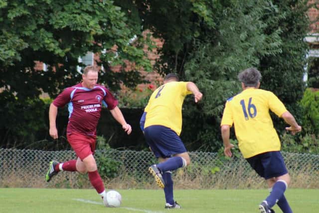 Andy Atkin on the ball during the veterans' match. Picture courtesy Catherine Gurney