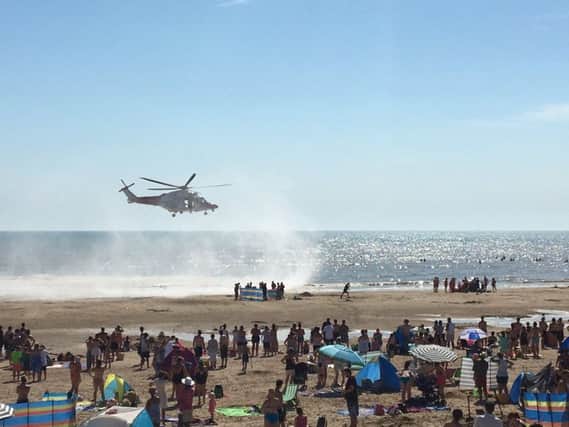 The air ambulance landing on the beach at Camber Sands. Photo by @Tashka4 on Twitter SUS-160824-172733001