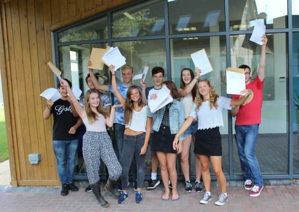 Claremont Senior School students celebrate the school's best ever set of GCSE results. Photo by Claremont SUS-160825-110932001