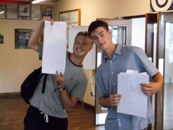 Priory School pupils pose with their results