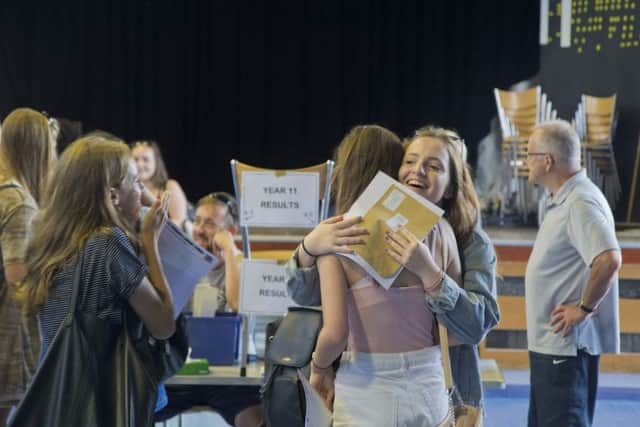 St Richard's Catholic College students pick up their GCSE results SUS-160825-125544001