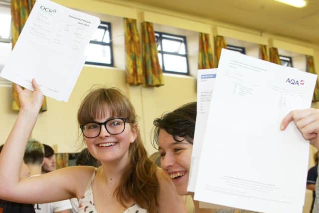 DM16137471a.jpg GCSE results, Selsey Academy. Charlotte Harding, left, and Olivia Allen. Photo by Derek Martin SUS-160825-130659008