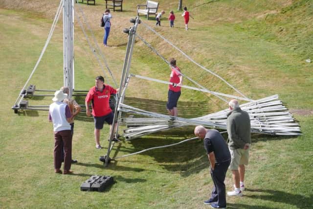 One of the sightscreens blows over in the strong wind at Horntye Park last weekend. Picture courtesy Regwood Photography