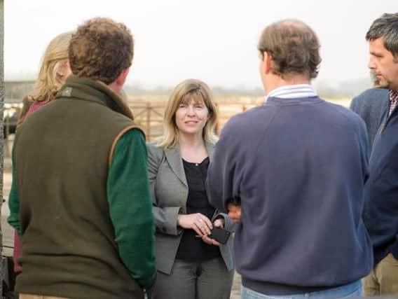 Lewes MP Maria Caulfield speaking with local farmers