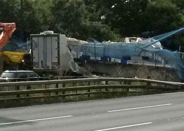 The scene on the M20 between Borough Green and Leybourne in Kent after a lorry hit a foot bridge and it collapsed. Picture: @emmaraphaelx / SWNS.com