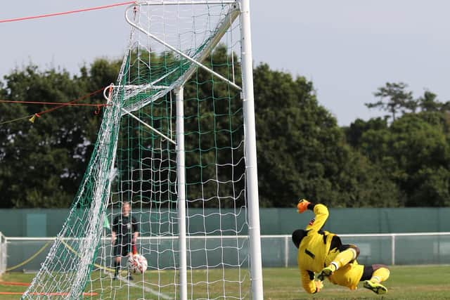 Chipstead's goalkeeper is beaten from the penalty spot for the second Hastings United goal. Picture courtesy Scott White