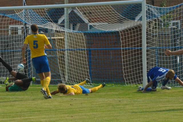 Max Miller scores the Heath's second goal. Haywards Heath Town v Lancing. Picture by Grahame Lehkyj