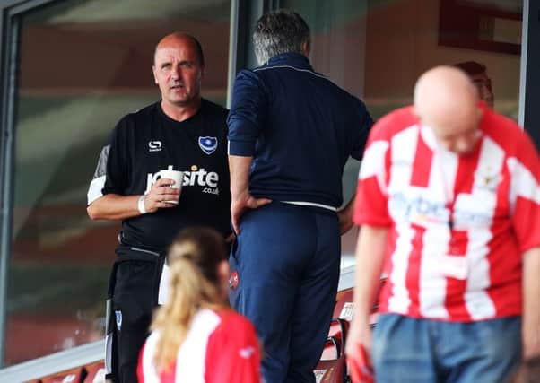 Pompey boss Paul Cook takes his seat in the stands at Exeter on Saturday. Picture: Joe Pepler
