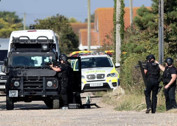Police at Pagham: Andrew Matthews/PA Wire POLICE_Pagham_173412.JPG