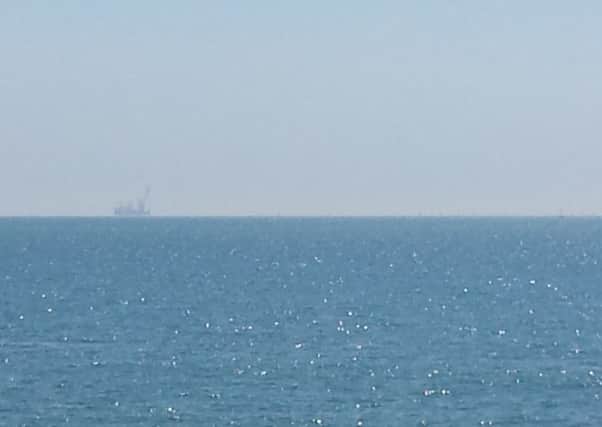 The wind farm site visible in the distance from Worthing Pier