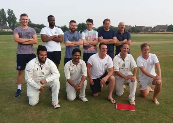 Slinfold celebrate promotion to Division 3 of the Sussex League on Saturday