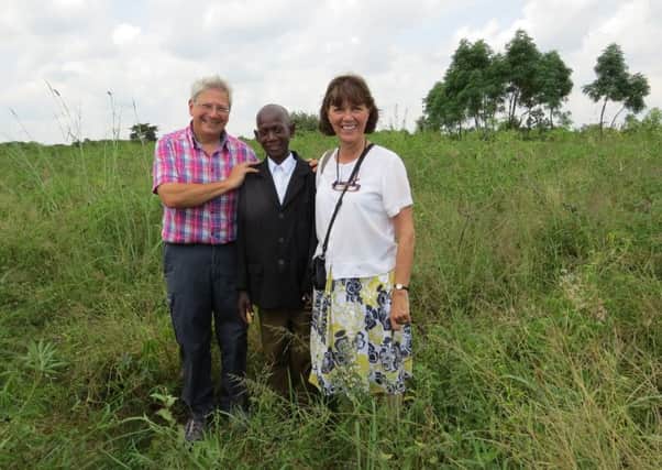 Peter and Pauline Sutton with David in Uganda