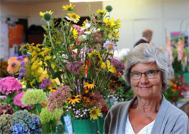 Linda Charman with her prize-winning vase of hardy perennials at the Worthing Horticultural Society autumn show 2016