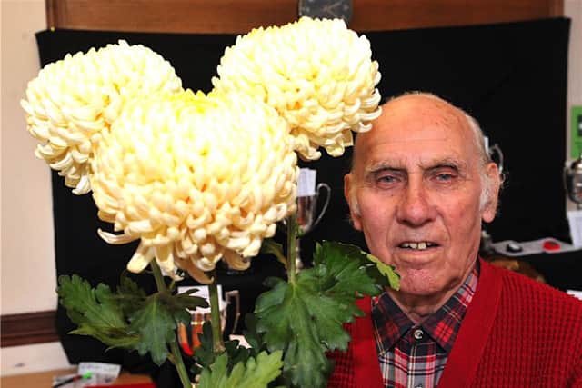 Tom Golds with his prize-winning blooms