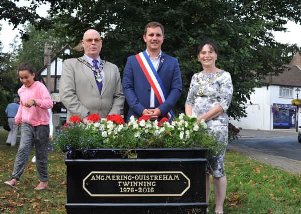 Chairman of Arun District Council Stephen Haymes, Romain Bail and Susan Francis at the commissioning of the commemorative planter