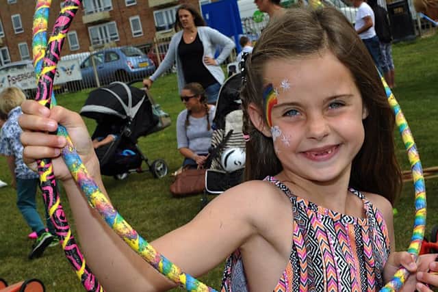 Lilly Loudon with her painted face and hoops at the Fishersgate Funfest