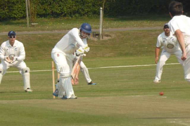 Bexhill batsman Malcolm Johnson pushes one into the off-side on his way to a half-century. Picture by Simon Newstead