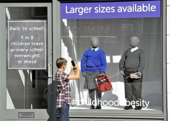 Cancer Research UK creates a school uniform shop to highlight the child obesity crisis. Photo: Adrian Brooks/Imagewise