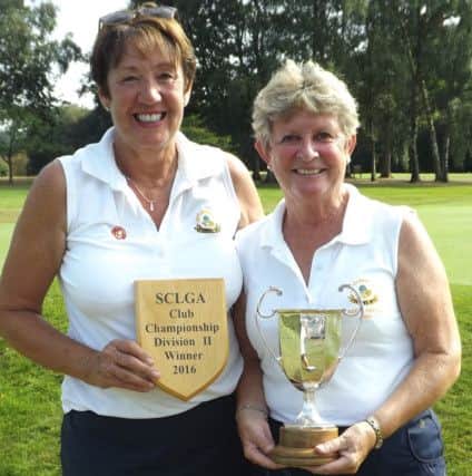 Copthorne Golf Club team captain Lynne Whalley and ladies captain Carole Hayward proudly holding the plaque and trophy SUS-160829-165013002