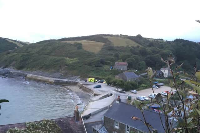 A search and rescue helicopter at the scene in Portholland, Cornwall where another man has died in the sea in a tragic holiday incident,