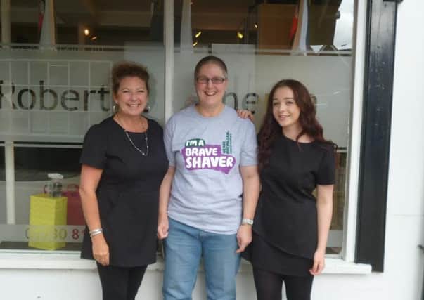 Trisha Cranfield, who had her head shaved for the cancer charity, with staff from hairdressers Robbie and Sheron's in Midhurst.