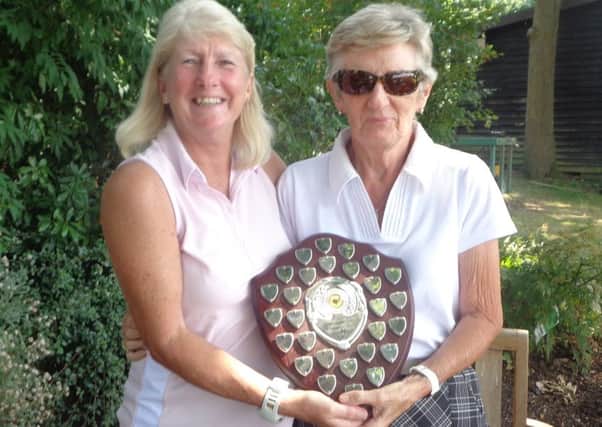 Rusper Golf Club's Val Barrett, right, winner of the Combination Trophy with lady captain Judith Marshall SUS-160829-213903002