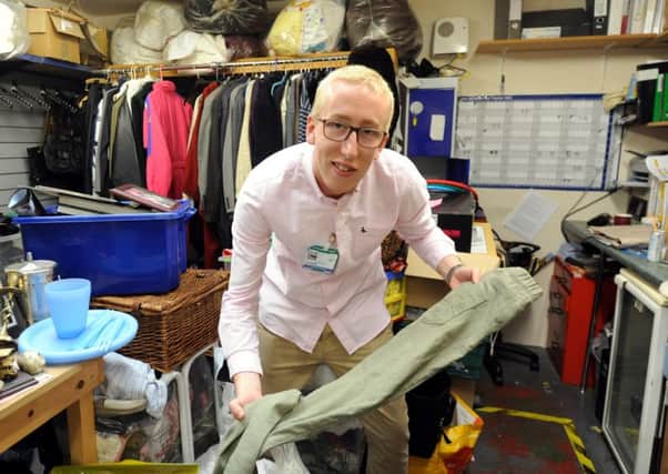 Tom Wyer at work at the  St Wilfrids Hospice  charityshop in  East Wittering. Picture: Kate Shemilt ks16000925-1