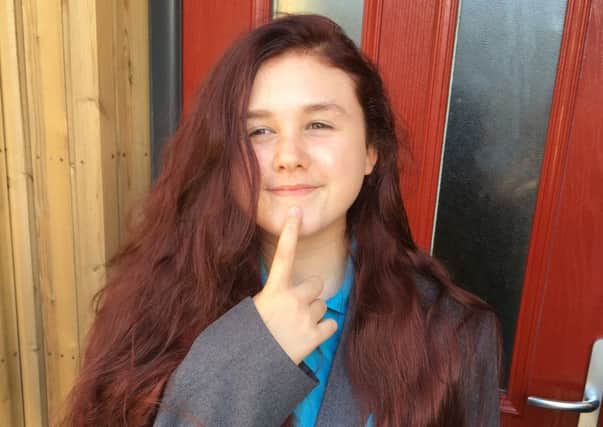 Jessica Wades hair after attempts to get it back to its natural brown. Photo by Alexandra Wade SUS-160914-140943001