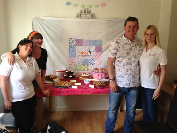 The East Sussex Sands team held a cake sale to raise money SUS-160209-164751001