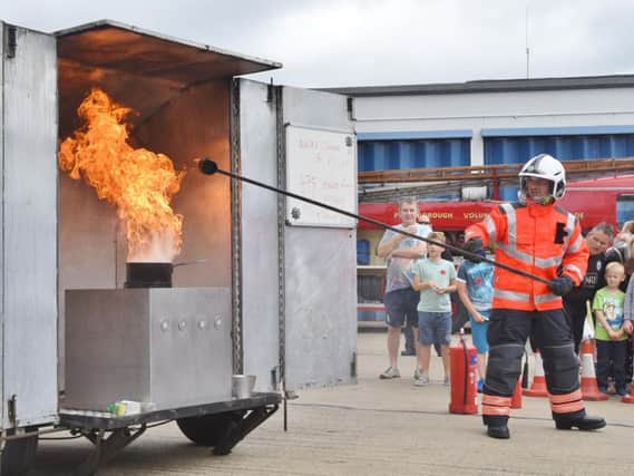 Firefighters demonstrate what happens when water is put on a chip pan fire