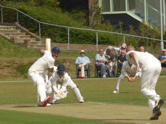 Bexhill opening batsman Sam Roberts shapes up a drive off the bowling of Bradley Payne.