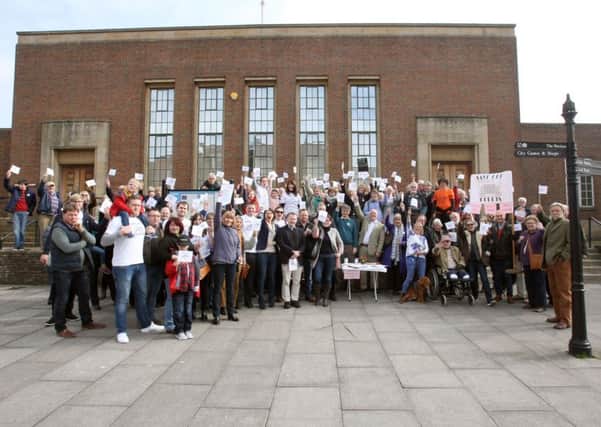Lawyers, residents and councillors outside Chichester Crown Court protesting the closures in March. Photo by Derek Martin. SUS-161203-205422008