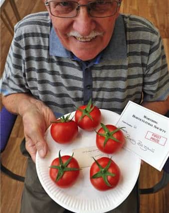 Barry Bezants with his prize winning tomatoes