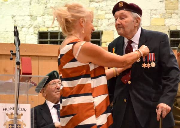 Frank Dougan received the Legion d'Honneur at a ceremony in Honfleur, Normandy SUS-160509-154652001