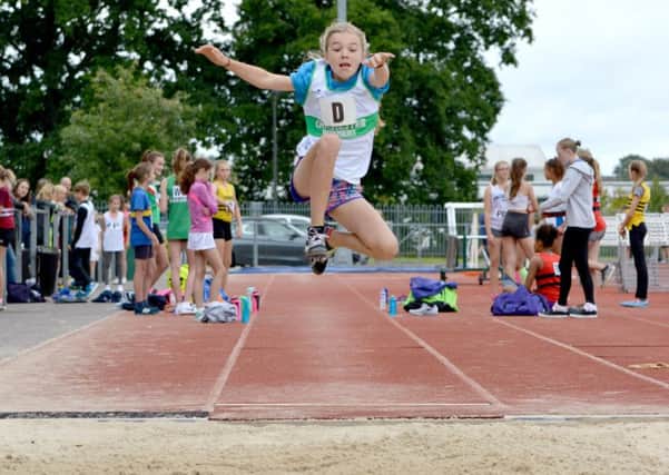 Long jump action for Chichester's under-13s at their grand final / Picture by Lee Hollyer