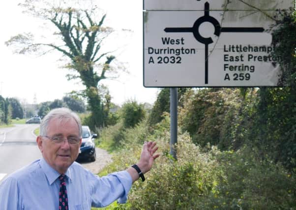 Sir Peter Bottomley with one of the local road signs