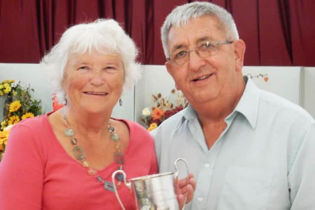 Charles Ashby presenting cup for cookery to Phyllis Hill