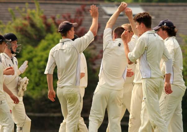 Stirlands players celebrate a Hellingly wicket earlier in the season / Picture by Chris Hatton