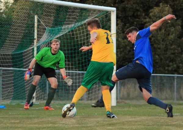 Callum Dowdell in recent action for Sidlesham / Picture by Chris Hatton