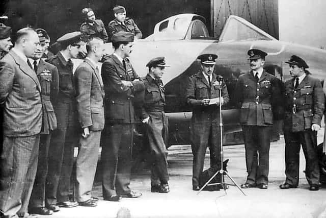 Group Captain Donaldson, 4th from right, listens to Air Marshal Sir James Robb September 1946