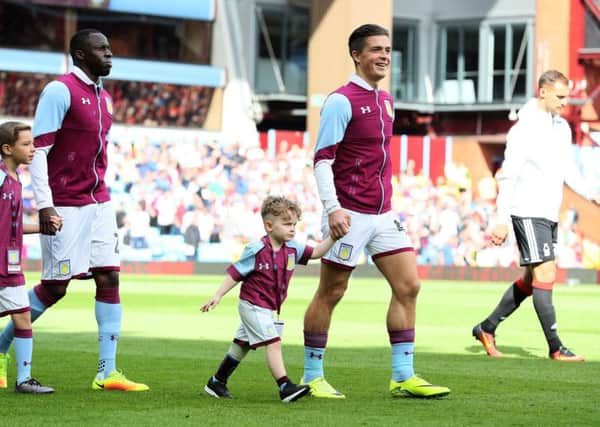Carter, four, with favourite player Jack Grealish walking out on to the Villa pitch