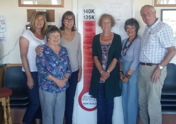Commodore Caroline Wylson,  members of the RHSC fundraising team and the fundraising thermometer . SUS-160913-132835001