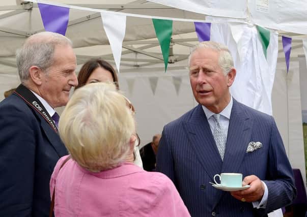Prince Charles meets Dominic Moore and Councillor Pru Moore. Photo Robin Bell SUS-161209-113025001