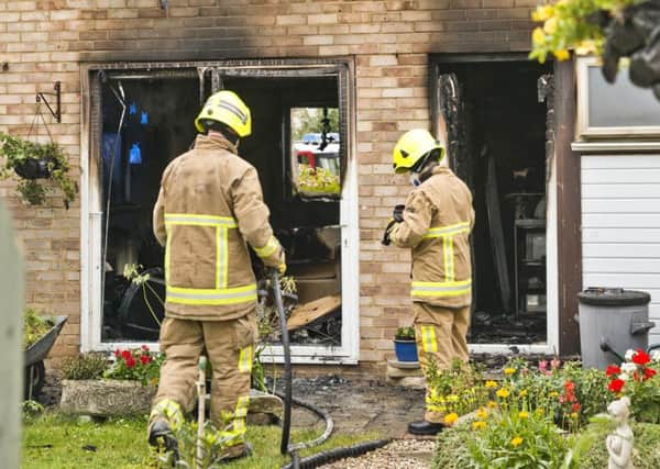 Firefighters at the scene of the blaze in Walesbeech, Furnace Green. Photo: Eddie Howland SUS-160913-095403001