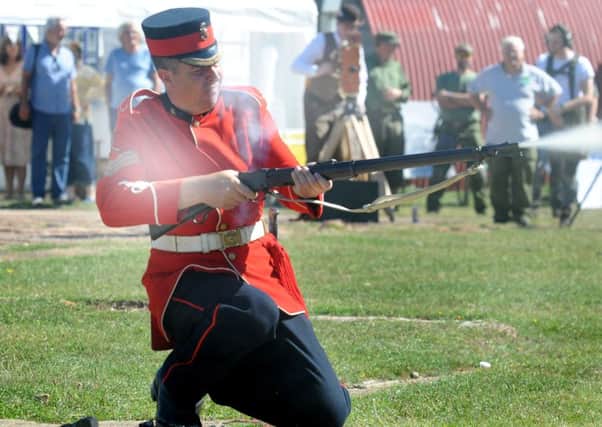 Gary Baines fires 16 shots in a minute from a 1887 Martini Henry Mk 4. SUS-161209-002458008