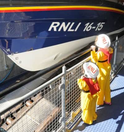 The public get a tour of the lifeboat head quarters. Pictured are Esme and Emme Horowitz. SUS-161209-002654008