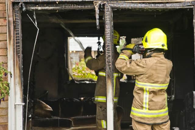 Firemen at the scene of the blaze in Walesbeech, Furnace Green. Photo: Eddie Howland SUS-160913-110643001