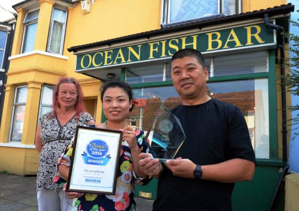 ks16000951-Fish and  Chip Award  phot kate
Owner, Rui Ma, right, Linda Chen and assisstnat Flow Michell celebrate their award.ks16000951-1 SUS-160913-210451008