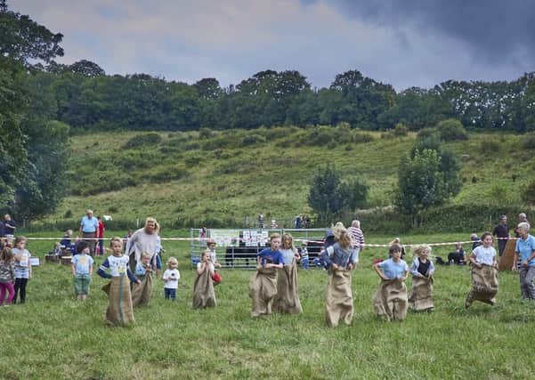 Children take part in the sack race at the Big Picnic